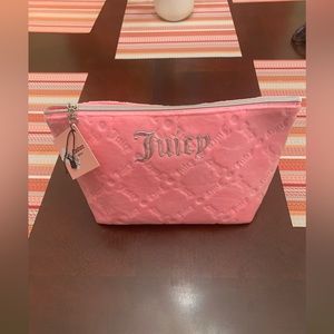 NWT Juicy Couture Pink Soft
Cosmetic Makeup Bag W/1 travel bottle.